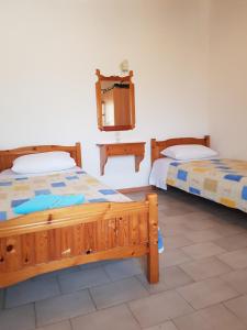 Posteľ alebo postele v izbe v ubytovaní Asimina's House