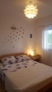 a bedroom with a bed with stars on the wall at Babić Rituals apartments in Makarska