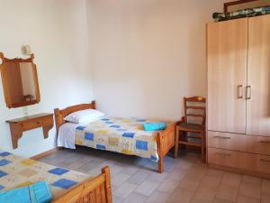Posteľ alebo postele v izbe v ubytovaní Asimina's House