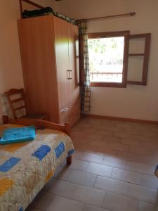 Posteľ alebo postele v izbe v ubytovaní Asimina's House
