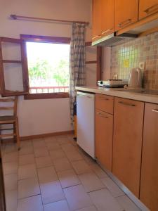Kuchyň nebo kuchyňský kout v ubytování Asimina's House + 29 fotografií