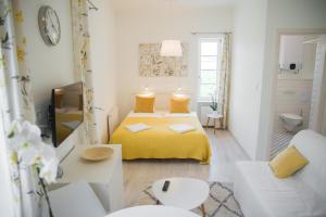 Ένα ή περισσότερα κρεβάτια σε δωμάτιο στο Rába Apartman House