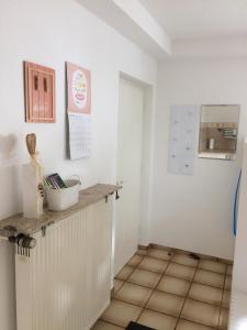 a kitchen with white walls and a counter top at FeWo Sirona in Wallerfangen