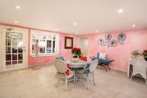 a dining room with a table and chairs at Sugar Bay Barbados - All Inclusive in Bridgetown