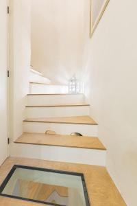 a glass floor in a house with stairs at Amelie in Rabat
