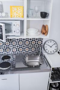 A kitchen or kitchenette at Rába Apartman House