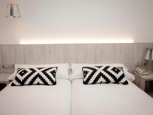 Postel nebo postele na pokoji v ubytování Hotel Restaurante Cadosa