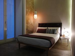 Posteľ alebo postele v izbe v ubytovaní B&B NAPOLI AMORE MIO