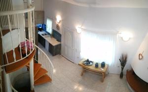 a room with a staircase and a room with a table at Nirvana house in Sani Beach