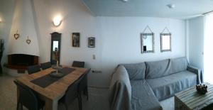 a living room with a couch and a table at Nirvana house in Sani Beach +40 photos