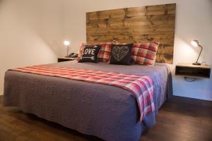 a bedroom with a bed with pillows on it at Eagle Cap Chalets in Joseph