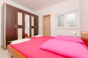 Posteľ alebo postele v izbe v ubytovaní Apartment Ivo