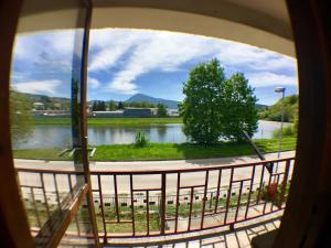 a view of a river from a window at Rodinný RETRO domček in Dolný Kubín