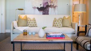 a living room with a couch and a coffee table at The Island House in Nassau +97 photos