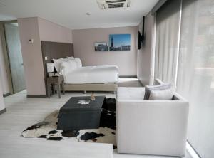 Postel nebo postele na pokoji v ubytování Hotel CityFlats