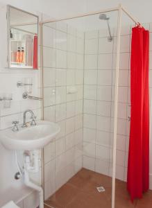 a bathroom with a sink and a shower at Trevalia Accommodation in Penwortham