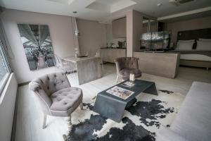 Kuchyň nebo kuchyňský kout v ubytování Hotel CityFlats
