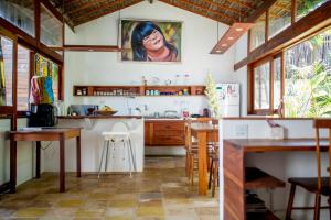 a kitchen with a sink and a counter top at Tropical House - Villa com piscina perto do mar in Jericoacoara