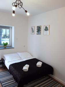 Posteľ alebo postele v izbe v ubytovaní Apartamenty METRO Targówek