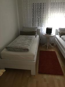 a bedroom with a bed and a table with a laptop at Luxeriöse Villa mit Bergblick in Donji Ljenobud +57 photos