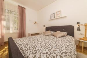Cama o camas de una habitación en Rok IN Apartments
