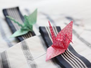 a red paper crane sitting on top of a fork at APA Hotel Tsubame-Sanjo Ekimae in Tsubame