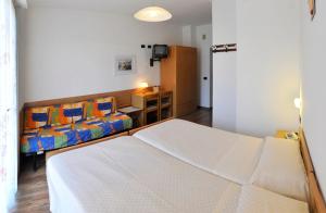 Postel nebo postele na pokoji v ubytování Villa Flora