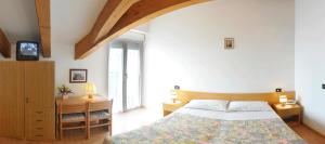 Postel nebo postele na pokoji v ubytování Villa Flora