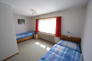 Postel nebo postele na pokoji v ubytování Ferienhaus Wanner + 4 fotografie