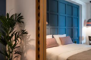 Posteľ alebo postele v izbe v ubytovaní Blue Island Luxury Apartment