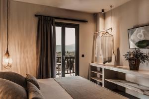 Postel nebo postele na pokoji v ubytování Doryssa Boutique Hotel + 30 fotografií