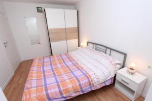 Łóżko lub łóżka w pokoju w obiekcie Apartments Palaziol