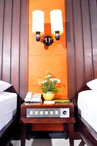 Una cama o camas en una habitación de Sari Ater Hotel & Resort