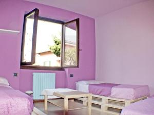 A bed or beds in a room at Villa Iris -Pet friendly stay - garden - private parking- Bike friendly holiday house