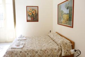 A bed or beds in a room at I Cavalieri di Malta