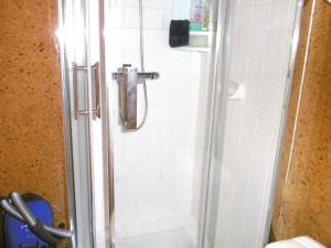 a shower stall with a toilet in a bathroom at Rozenn in Sarzeau +7 photos