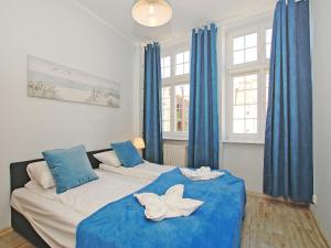 Posteľ alebo postele v izbe v ubytovaní Apartament Starogdański 51