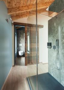 a bathroom with a glass shower with a toilet at B&B La Bellavita del Garda Luxury in San Felice del Benaco +63 photos