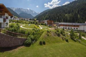 an aerial view of a village in the mountains at Appartamento Puez in Selva di Val Gardena