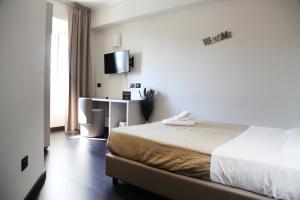 Postel nebo postele na pokoji v ubytování Hotel Sogni D'Oro Airport