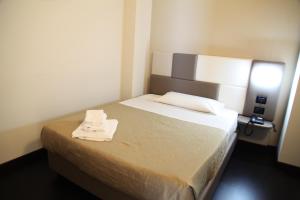 Postel nebo postele na pokoji v ubytování Hotel Sogni D'Oro Airport