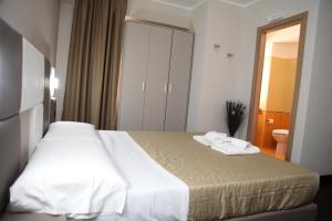 Postel nebo postele na pokoji v ubytování Hotel Sogni D'Oro Airport