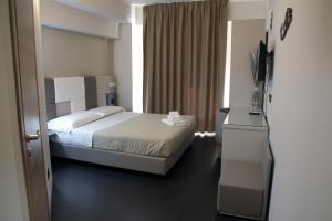 Postel nebo postele na pokoji v ubytování Hotel Sogni D'Oro Airport