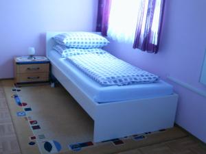 Ein Bett oder Betten in einem Zimmer der Unterkunft Gästehaus Maria