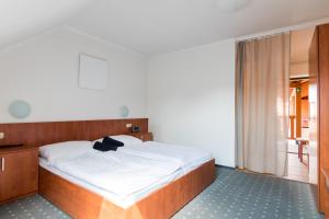 Posteľ alebo postele v izbe v ubytovaní Apartmány Fojtova studna