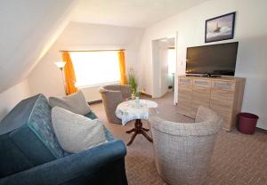 Zona d'estar a Appartements Fischerdorf Alt Redde