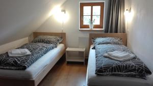 Postel nebo postele na pokoji v ubytování Apartmány Nová Pec