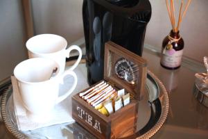 a table with a box of matches and a coffee mug at Green Cottage in Büdelsdorf
