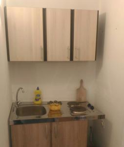 a kitchen with a sink and a counter top at Apartment Angelina in Risan