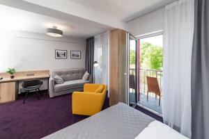 Posteľ alebo postele v izbe v ubytovaní Apartamenty PORTO